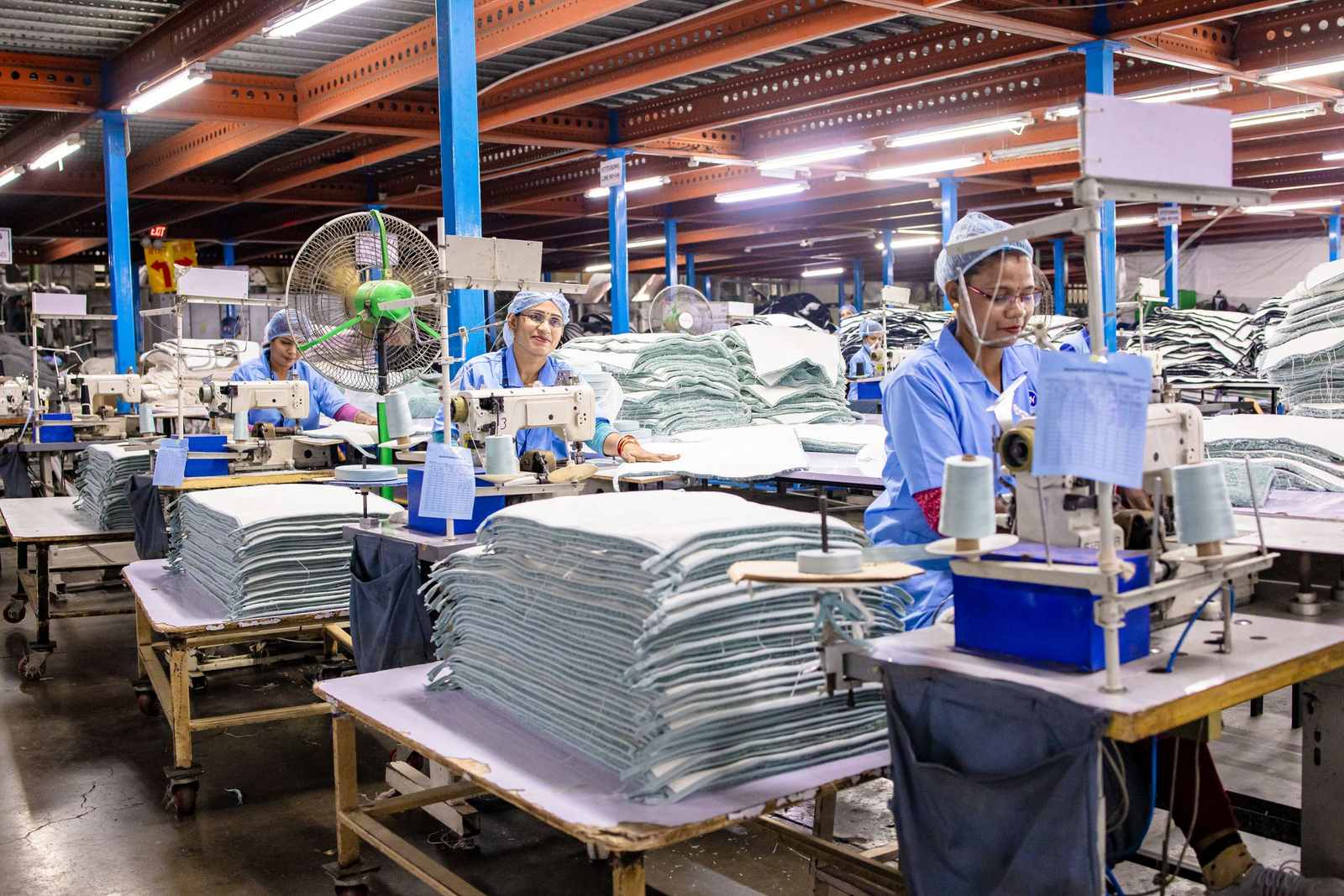 Textile production team working at sewing stations