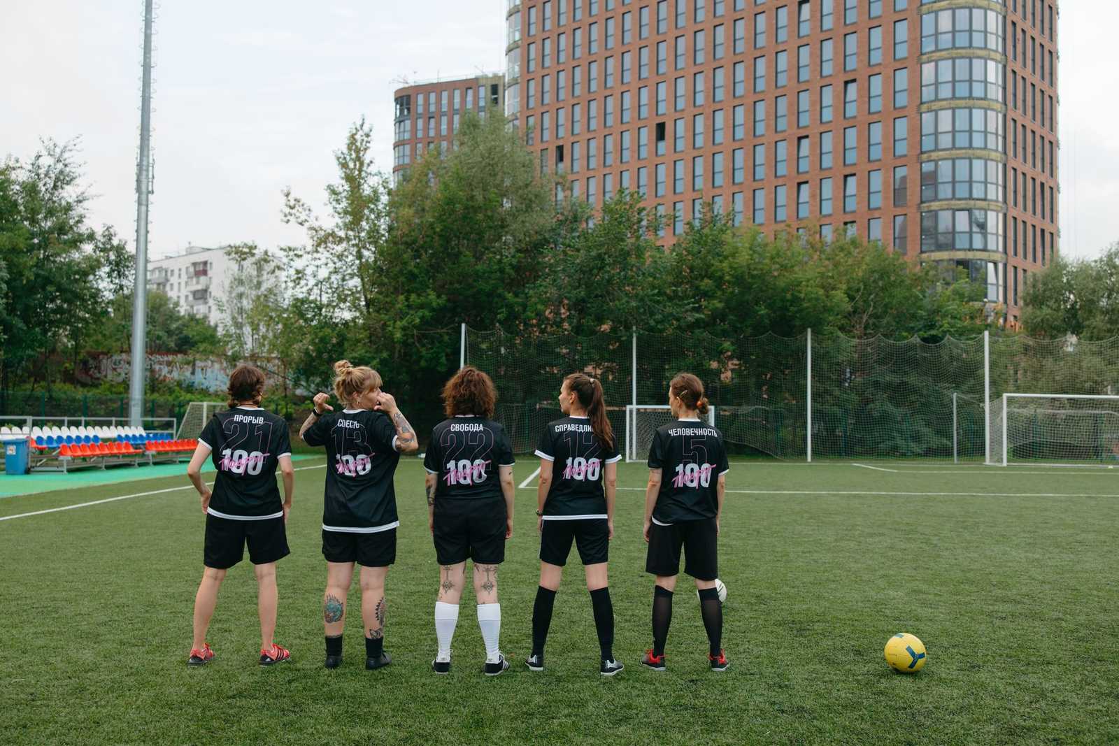 Women football players standing together on a field